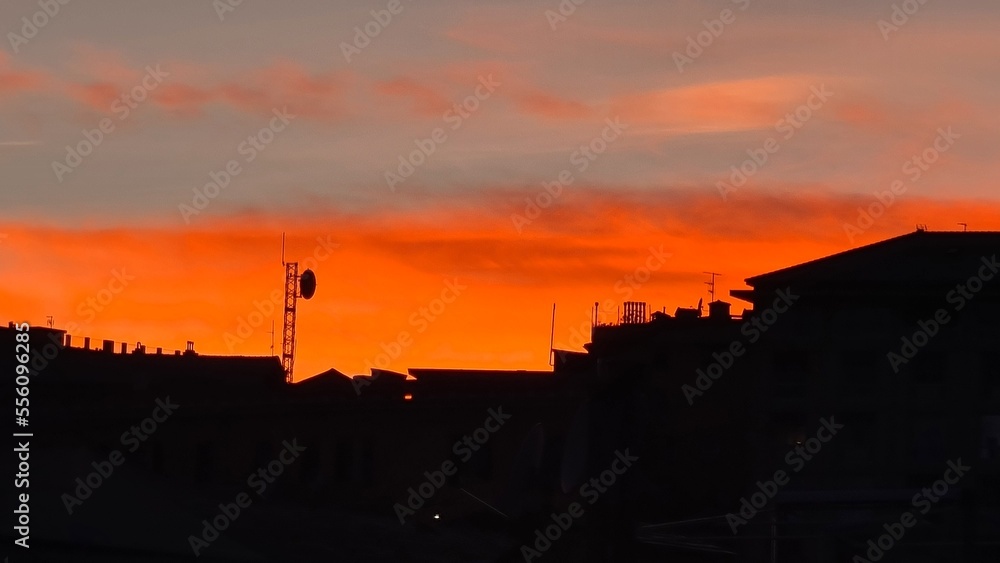 Genova, Italy-November 19, 2022:bBautiful sunset reflection of sky with sundown.The sky with nightfall majestic sundown.Colorful sunset with red and orange colours. Genova, Italy-November 19, 2022:bBautiful sunset reflection of sky with sundown.The sky with nightfall majestic sundown.Colorful sunset with red and orange colours.