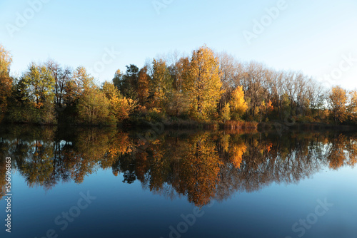 Fototapeta Naklejka Na Ścianę i Meble -  Picturesque view of lake and trees on autumn day