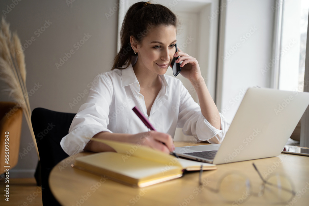 Uses a laptop workplace in the office. The manager makes a report for the month. A female freelance designer is working on an online project. Uses a laptop workplace in the office. The manager makes a report for the month. A female freelance designer is working on an online project.