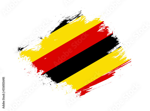 Uganda flag with abstract paint brush texture effect on white background