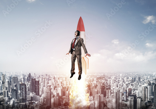 Obraz na płótnie Business person in aviator hat flying on rocket w salonie