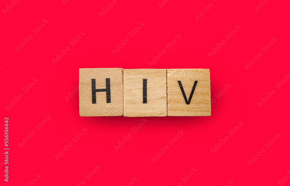 HIV abbreviation on dark red background. Human Immunodeficite Virus. Healthcare medicine concept. HIV abbreviation on dark red background. Human Immunodeficite Virus. Healthcare medicine concept.