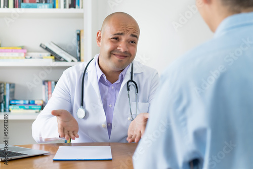 Doctor talking with patient about cancer surgery