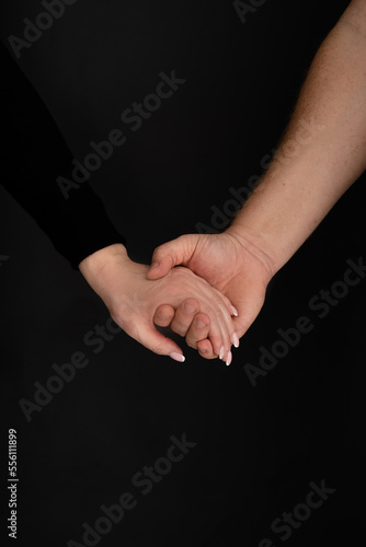 Women's and men's hands. Together.