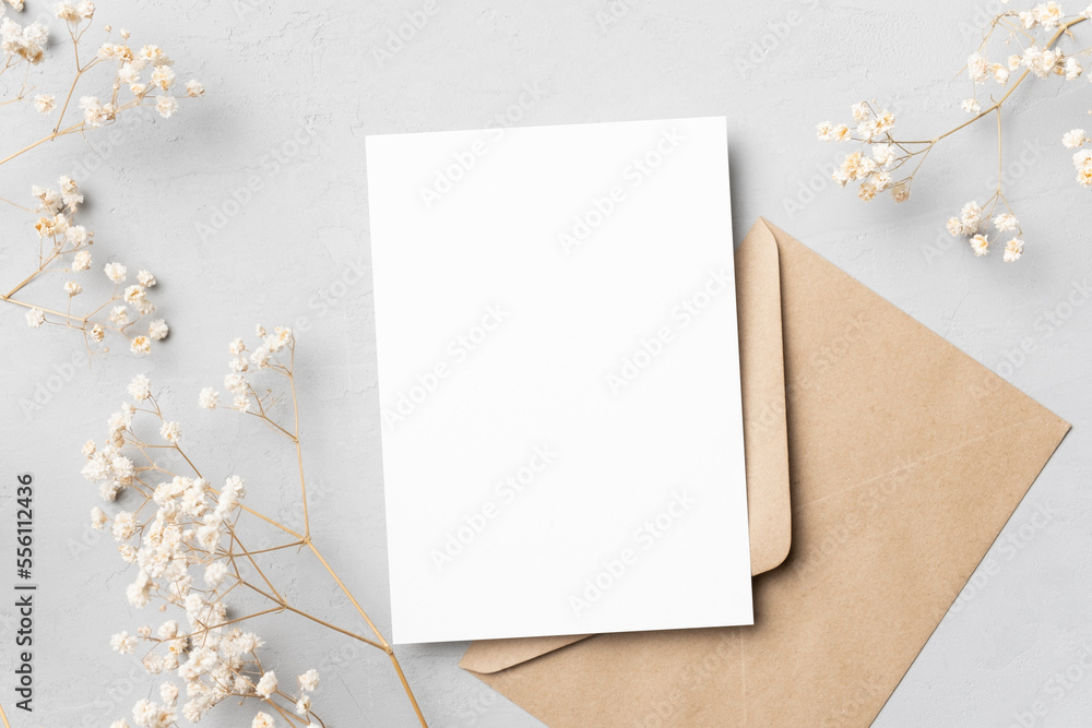 Invitation or greeting card mockup with dry gypsophila, blank card with botanical decoration