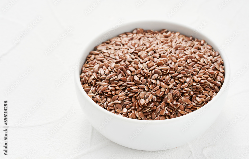 Flaxseed linseed in bowl on white table background. Flaxseed linseed heap on white background. Pile of Flaxseed linseed in bowl on white background. flax seed Flaxseed linseed in bowl on white table background. Flaxseed linseed heap on white background. Pile of Flaxseed linseed in bowl on white background. flax seed