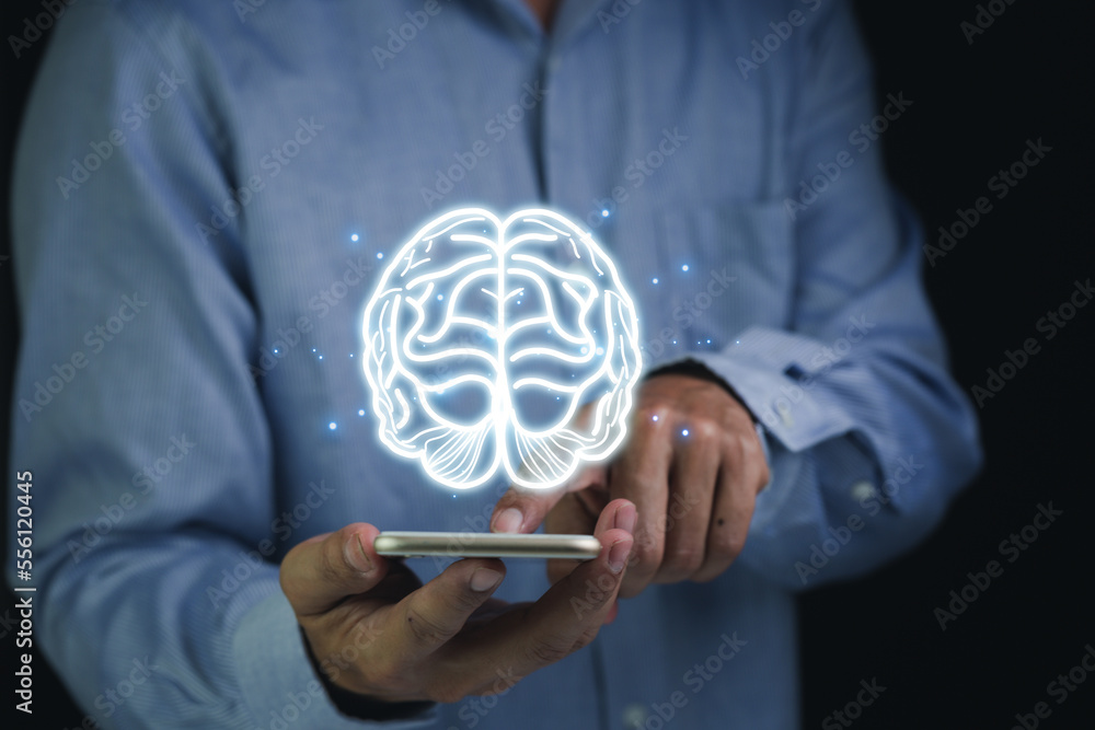 Close up of businessman hand holding brain in palm, Virtual reality man with symbol neurons in the brain. Concept of idea and innovation, on wooden table. Close up of businessman hand holding brain in palm, Virtual reality man with symbol neurons in the brain. Concept of idea and innovation, on wooden table.