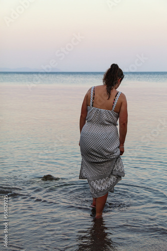 woman on the beach at sunset