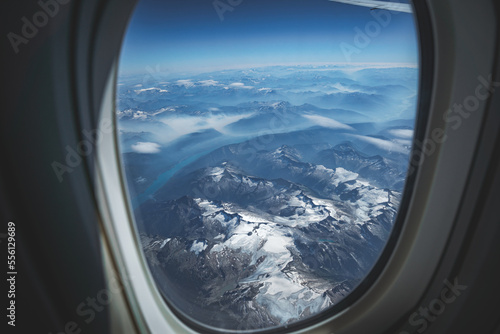 view from the plane window on mountain landscape