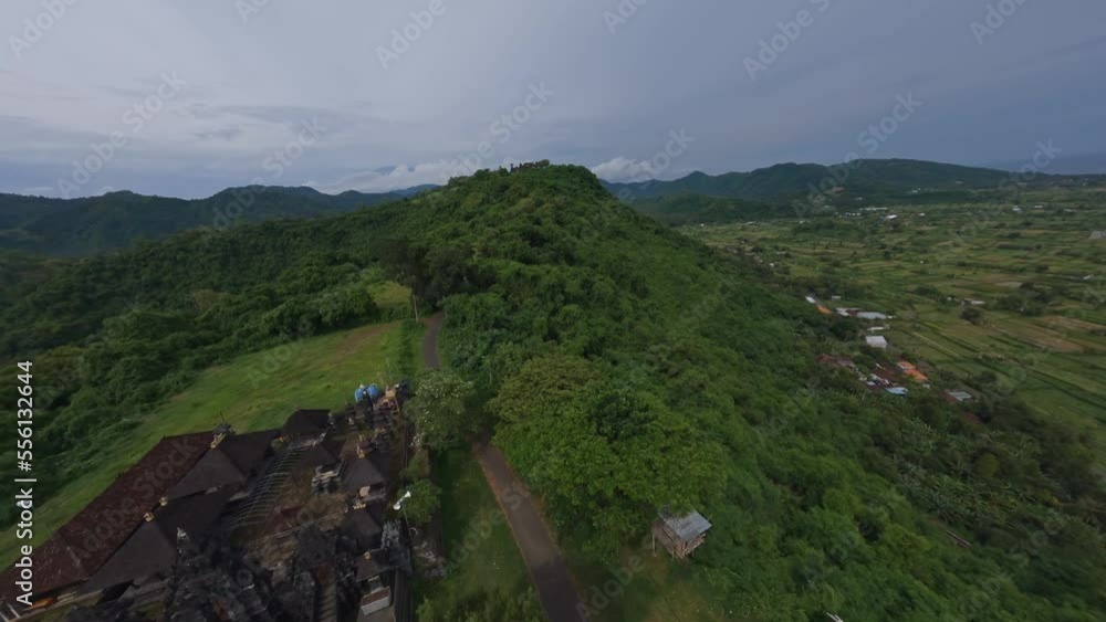 Jungle Ridge FPV sports drone shot religious Hindu temple jungle ridge mountain ...