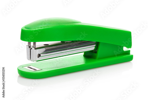 Green stapler, isolated on white background photo
