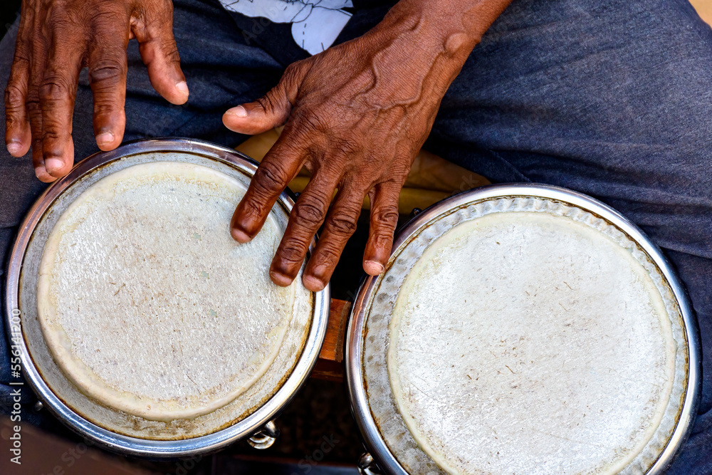 Hands and istrument of musician playing bongo in the streets of Pelourinho in Salvador in Bahia