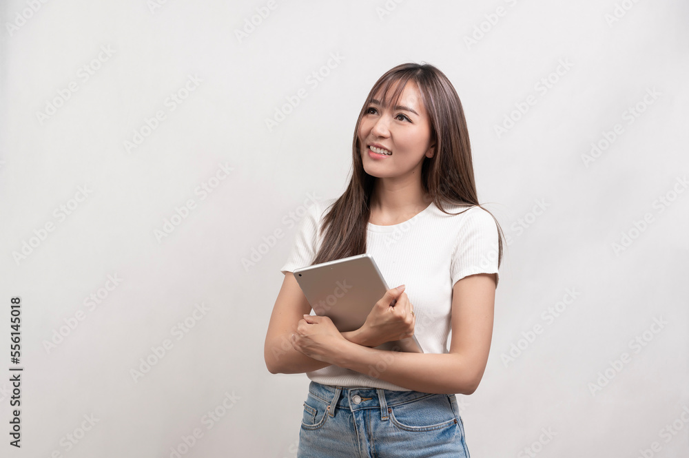 Young asian woman using tablet over white background, technology concept Young asian woman using tablet over white background, technology concept