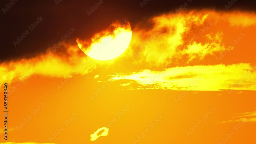Red epic sunset through dark yellow orange clouds, cinematic skyline. Red epic sunset through dark yellow orange clouds, cinematic skyline.