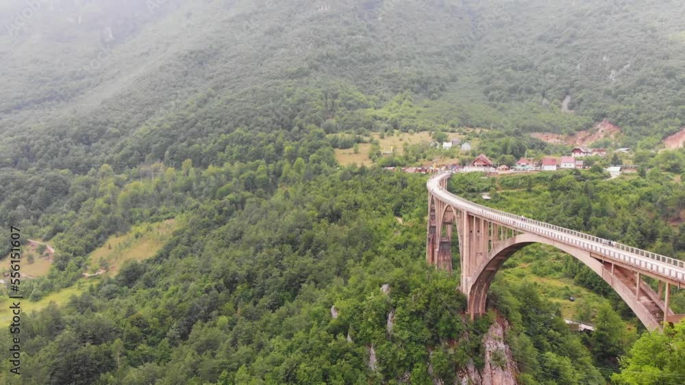Aerial of Djurdjevica Bridge over Tara river canyon in Montenegro. Grerat tourist attraction and unique architectural structure Aerial of Djurdjevica Bridge over Tara river canyon in Montenegro. Grerat tourist attraction and unique architectural structure