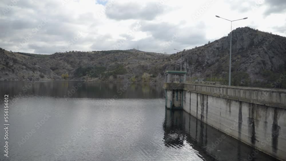 Side view of dam lake, damp old dam wall Side view of dam lake, damp old dam wall
