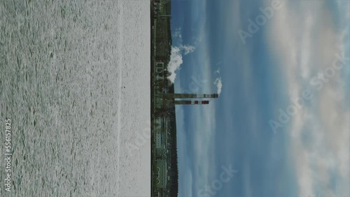 View of the tall chimneys of an industrial enterprise with a chimney polluting the atmosphere. The plant for the production of strategic intercontinental missiles 