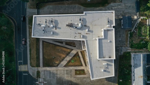 Roof with all communications of a modern office building. The roof of the medical center. Building communications: air extraction, ventilation shafts, antennas, communication centers, telephones.