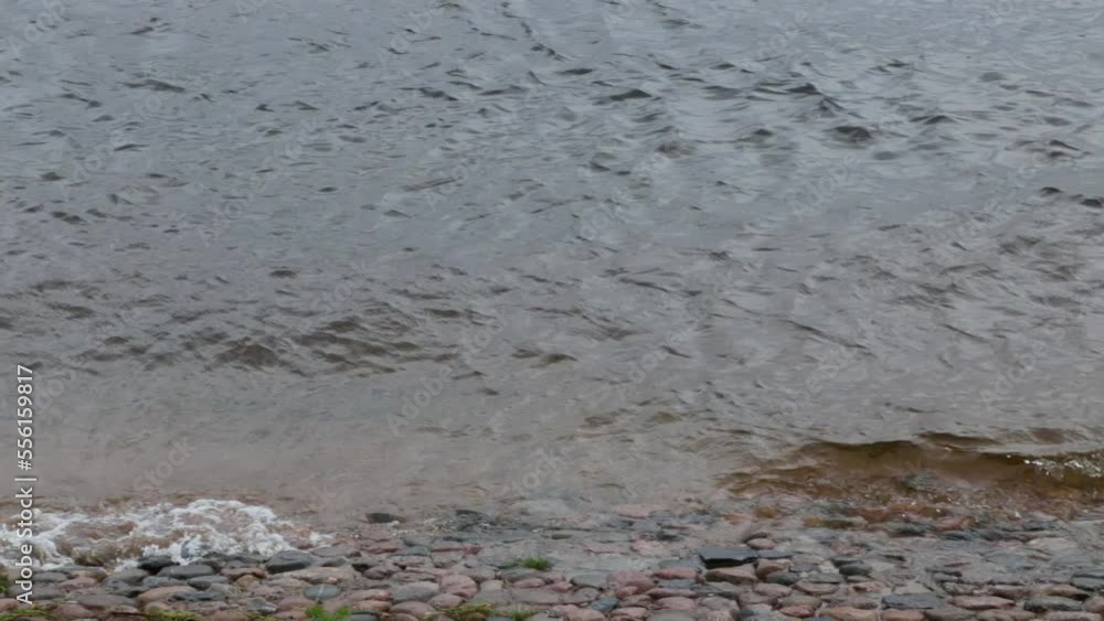 Rocky bank of the river in cloudy weather. Rocky bank of the river in cloudy weather.
