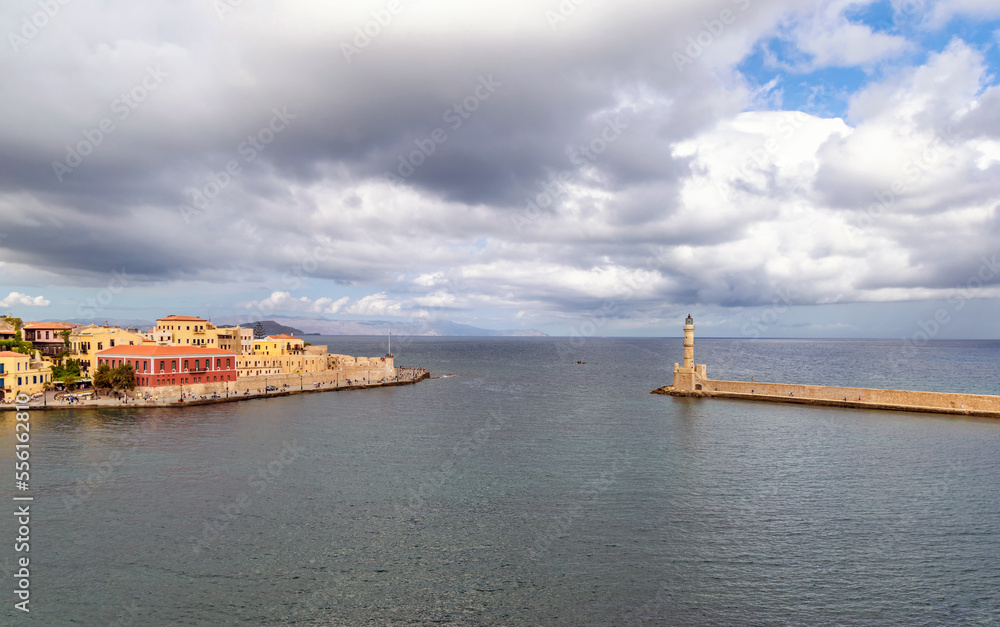Landmarks of Crete - Panorama View of venetian port of Chania and lighthouse in old harbour of Chania, Greece. High quality photo