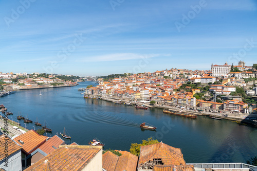 Douro river with the city of Porto on its banks and a historical ship sailing on the river Douro, Portugal