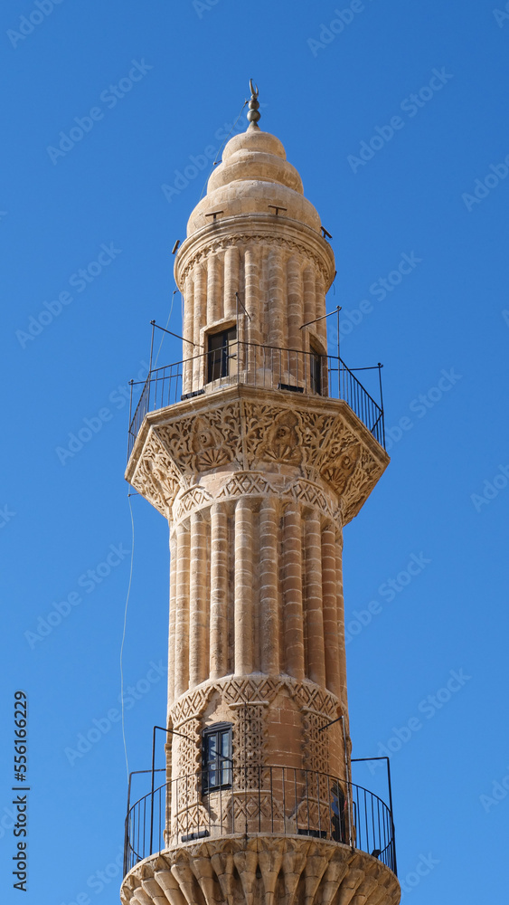 The minaret of an ancient mosque (Mardin, Turkey) The minaret of an ancient mosque (Mardin, Turkey)