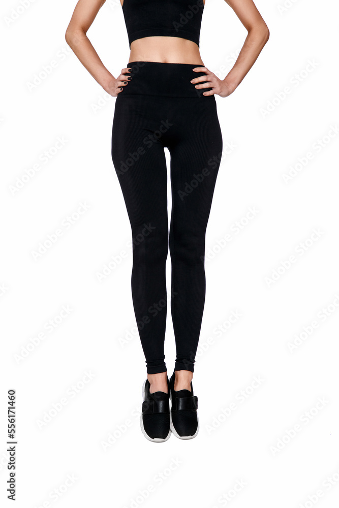 slim female legs in black sport leggings jumping slim female legs in black sport leggings jumping