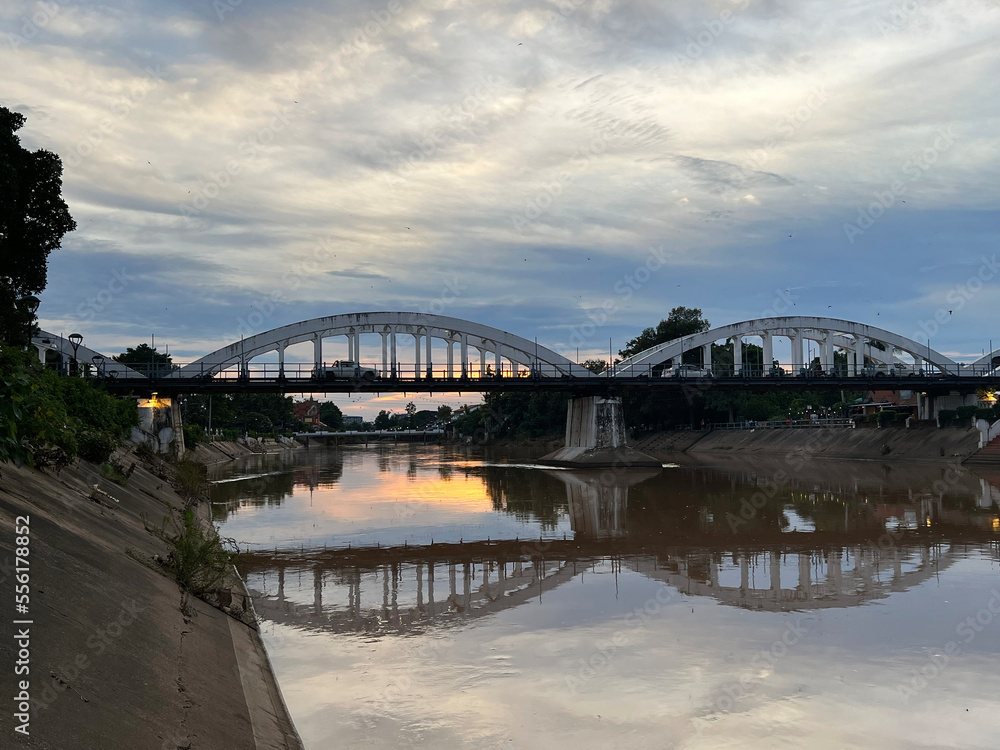 Rassadapisek Bridge over the Wang river at sunset