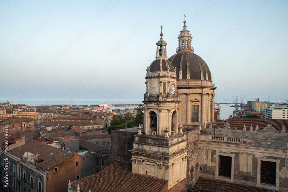 View at Catania Cathedral and Ionian sea from the dome of the Abbey of St Agatha at sunset, Sicily, Italy