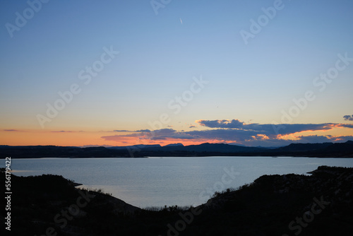 sunset on the lake Embalse de la Pedrera in Spain photo