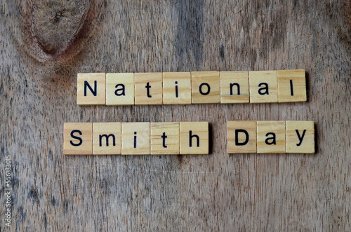 National Smith Day text on wooden square, holiday concept quotes photo