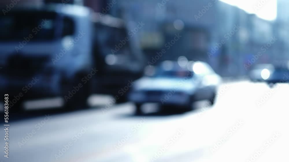 Cars are driving on the road. Blurring the view. Plug. People are going to work. People in cars are going on business. Cars are driving on the road. Blurring the view. Plug. People are going to work. People in cars are going on business.