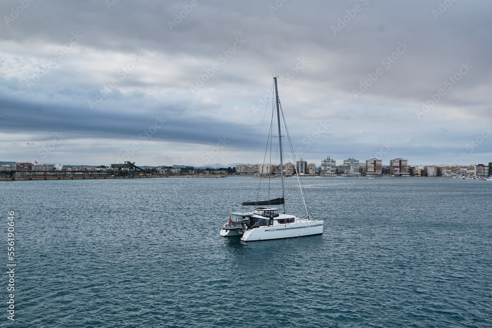 Yacht on blue water.
View of the yacht in the open sea Yacht on blue water.
View of the yacht in the open sea