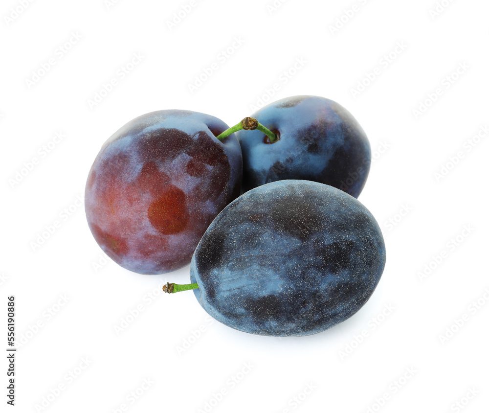 Obraz premium Delicious fresh ripe plums on white background