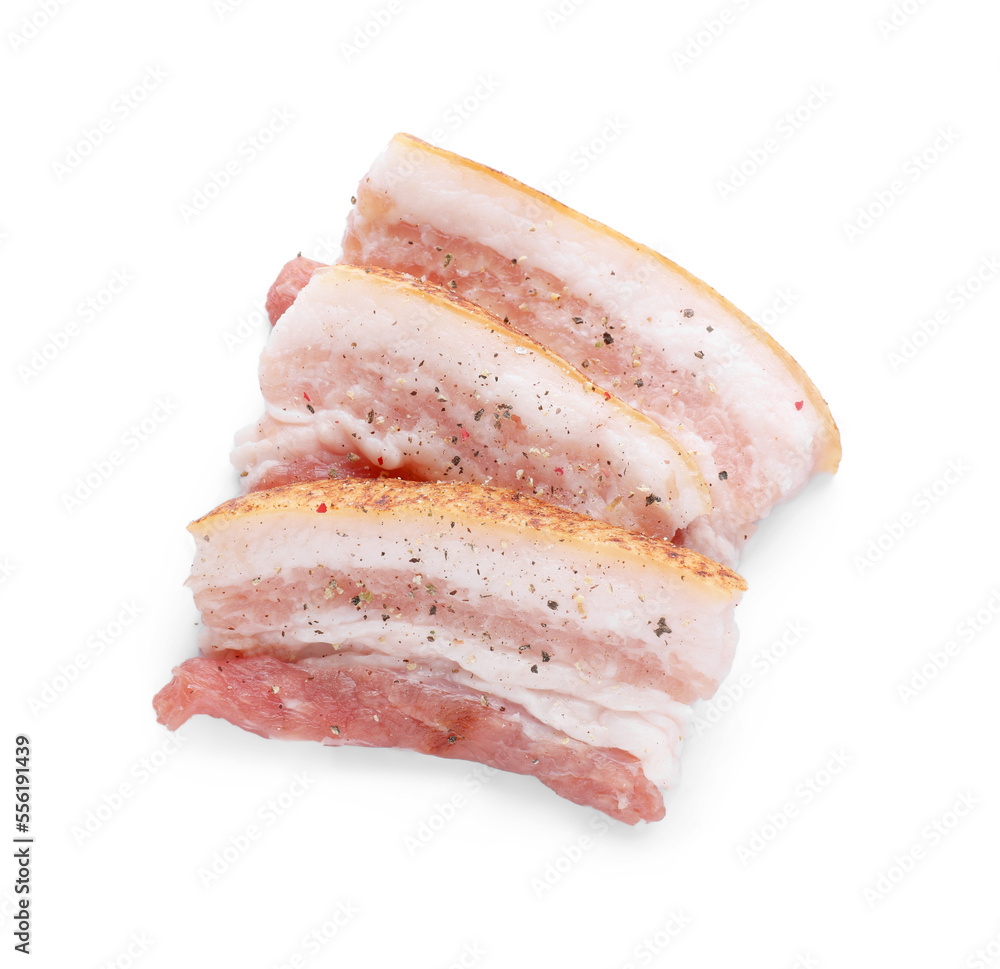 Slices of tasty pork fatback with spices isolated on white, top view