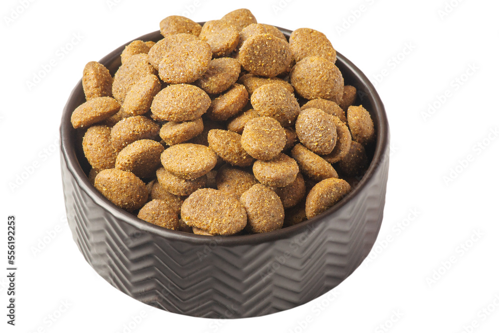 Dry pet food in a black bowl. Food is balanced for animals. Dry pet food in a black bowl. Food is balanced for animals.