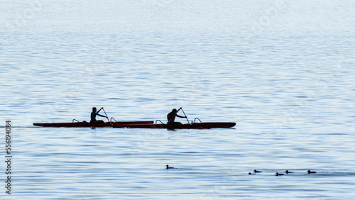 People are kayaking in the ocean