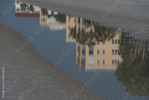 Resort building reflections in tide pond during low tide at Madeira beach photo