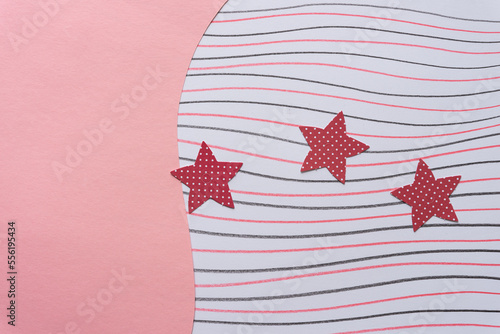 smooth(ish) pink paper with wave element and paper with wavy lines, including 3 paper stars with dots photo