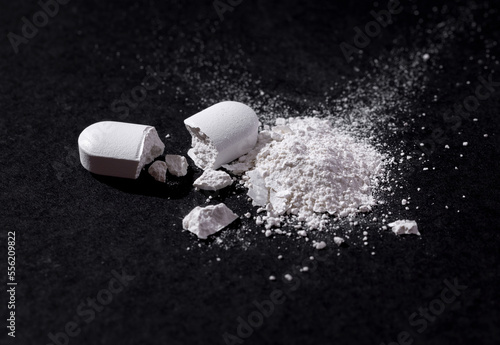 Drugs, pills are cut and scattered on the floor