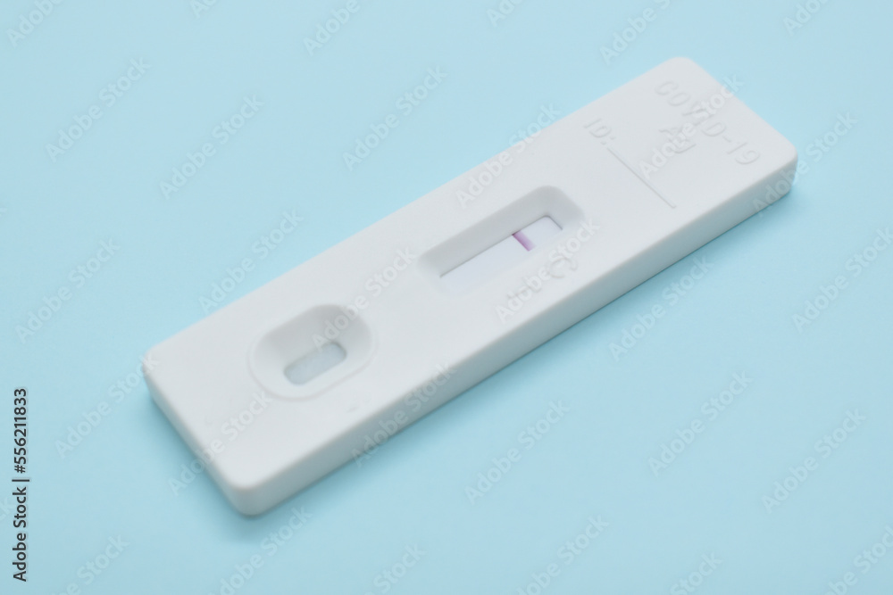 covid test kit on blue background covid test kit on blue background