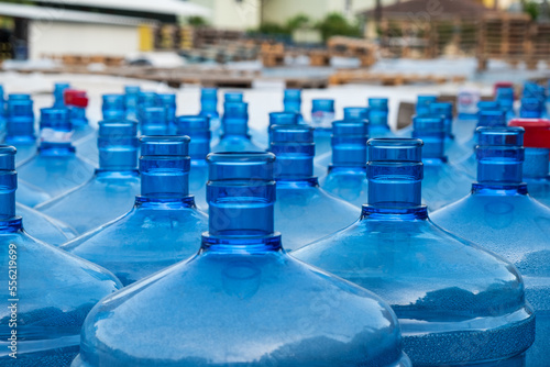 many large plastic water bottles