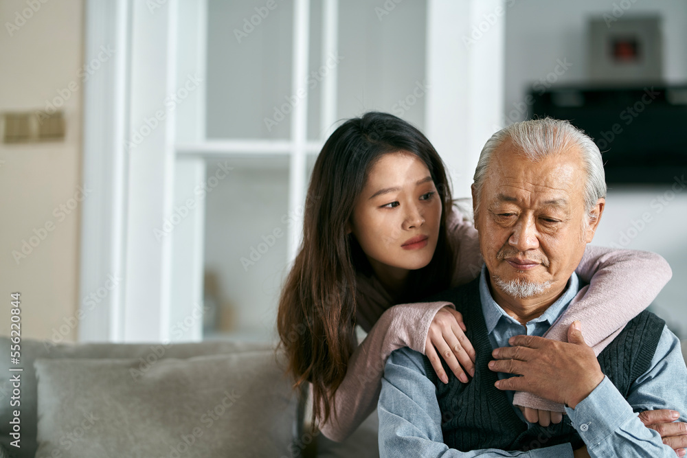 © imtmphoto - young asian adult daughter conforting senior father at home © imtmphoto - young asian adult daughter conforting senior father at home