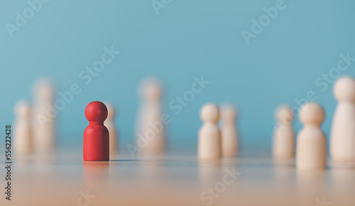 A wooden doll sits on the table,HRM or Human Resource Management,leadership in recruitment,Business development by choosing professional leaders employee competency teamwork,Taregt customer