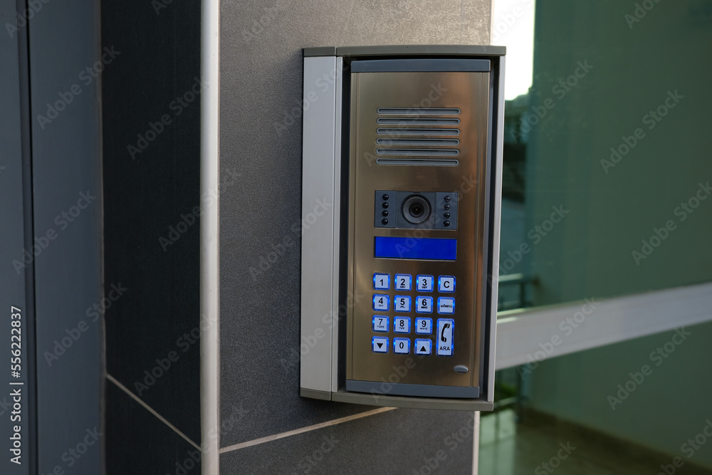 Intercom at the door of a building with security identification camera
Copy space
Intercom at the door of a building with security identification camera
Copy space