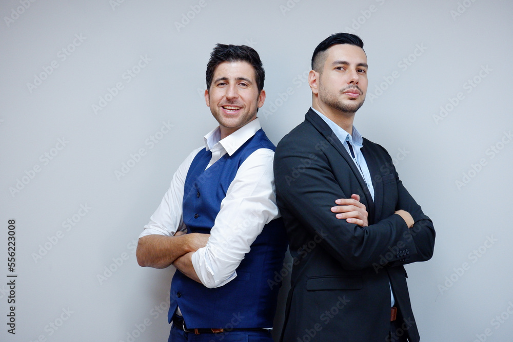 Handsome young businessman in suit smiling on white background. Business concept. Handsome young businessman in suit smiling on white background. Business concept.