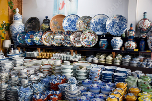 Famous Arita porcelain - dishes and vases of various shapes decorated with underglaze blue in a store in Arita, Japan, expensive luxury ware, traditional kaolin clay pottery