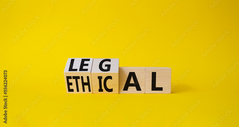 Ethical and Legal symbol. Turned wooden cubes with words Ethical and Legal. Beautiful yellow background. Business and Ethical and Legal concept. Copy space Ethical and Legal symbol. Turned wooden cubes with words Ethical and Legal. Beautiful yellow background. Business and Ethical and Legal concept. Copy space