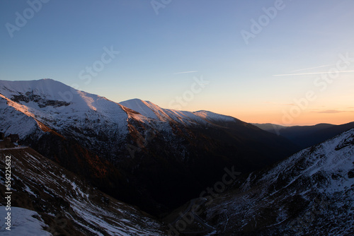 Landscape with golden hour light on the snow on the Fagaras mountains