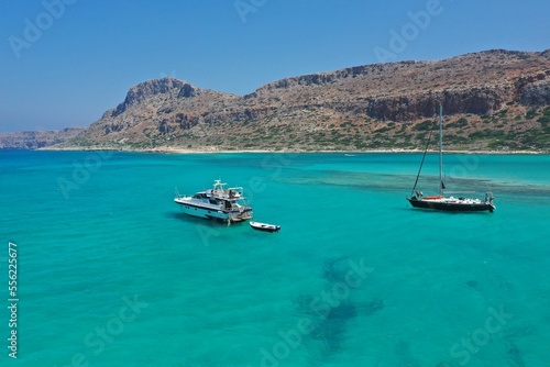 Calm blue sea on a sunny day. Yachts with turists are sailing on Libian sea . © Rafik
